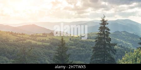 Panoramic view of mountains under cloudy sky Stock Photo