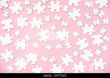 White puzzle pieces of different size Stock Photo