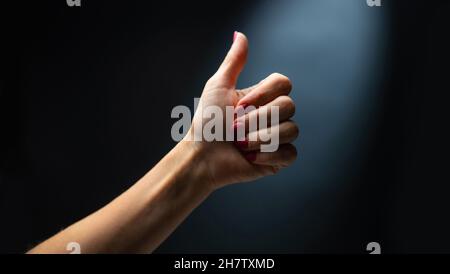 Hand shows signs with fingers Stock Photo