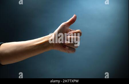 Hand shows signs with fingers Stock Photo