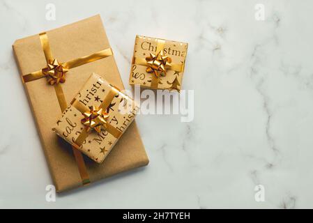 Merry Christmas. Top view of christmas gifts box with space for text on a marble table. Christmas concept background Stock Photo