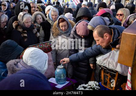 KYIV, UKRAINE - Nov. 24, 2021: Several hundred people protest against coronavirus restrictions and mandatory vaccinations. Stock Photo