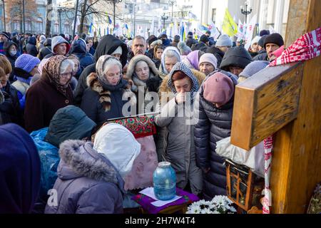 KYIV, UKRAINE - Nov. 24, 2021: Several hundred people protest against coronavirus restrictions and mandatory vaccinations. Stock Photo