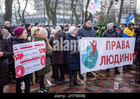 KYIV, UKRAINE - Nov. 24, 2021: Several hundred people protest against coronavirus restrictions and mandatory vaccinations. Stock Photo