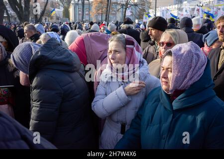 KYIV, UKRAINE - Nov. 24, 2021: Several hundred people protest against coronavirus restrictions and mandatory vaccinations. Stock Photo