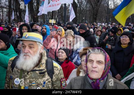 KYIV, UKRAINE - Nov. 24, 2021: Several hundred people protest against coronavirus restrictions and mandatory vaccinations. Stock Photo