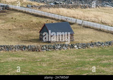 RUNDE, NORWAY - 2020 APRIL 07. Old stone farm house for animal at Runde. Stock Photo