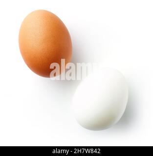 Peeled boiled egg and boiled egg in shell isolated on white background, top view Stock Photo