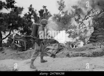 WOLMI ISLAND, KOREA - September 1950 - A US Marine uses a flamethrower to clear a bunker on Wolmi Island before pushing on to Inchon during the Korean Stock Photo