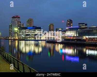 Media City UK and The Quays Theatre reflected in the Manchester Ship Canal at Salford Quays City of Salford Greater Manchester England Stock Photo