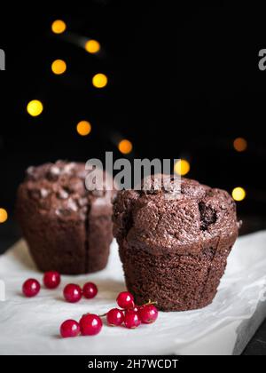Christmas Chocolate muffins and red currants. Beautiful food, holiday, birthday, special occasions Stock Photo