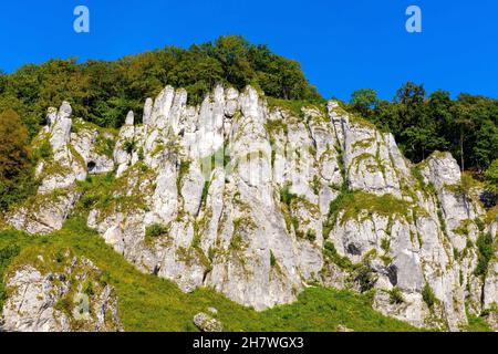 Crown rocks - Skaly Koronne - Jurassic limestone mountain massif with Glove Rock - Rekawica - in Pradnik creek valley of Cracow-Czestochowa upland in Stock Photo