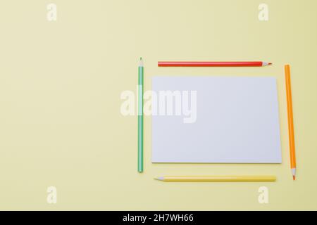 an empty sketchbook and pencils Stock Photo