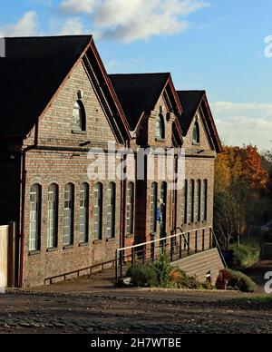 Hatton locks workshops, the harsh autumn sun high lights the roof and windows on the canal workshops on the Grand Union canal in Warwickshire