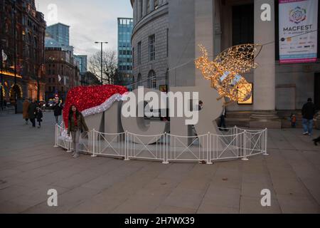 Christmas Hat On The MCR Logo In Front Of The Library At Manchester England 8-12-2019 Stock Photo