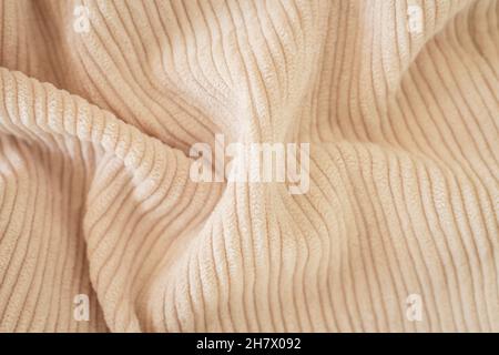 Ribbed beige corduroy or velvet texture background top view Stock Photo