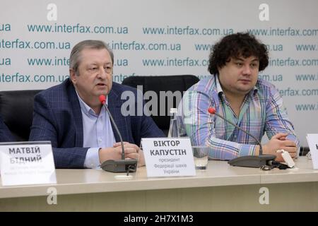 KYIV, UKRAINE - NOVEMBER 25, 2021 - President of the Ukrainian Chess Federation Viktor Kapustin (L) and Team Ukraine member Anton Korobov are pictured Stock Photo