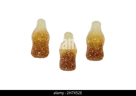Cola flavored gummy jellies in the shape of cola bottles,isolated on white background. Stock Photo