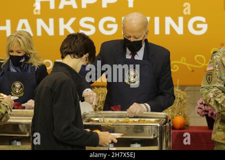 Fort Bragg, United States of America. 23 November, 2021. U.S President Joe Biden and First Lady Jill Biden serve turkey dinner to celebrate an early Thanksgiving with service members at Fort Bragg November 22, 2021, in Fort Bragg, North Carolina. Credit: Spc. Casey Brumbach/U.S. Army/Alamy Live News Stock Photo