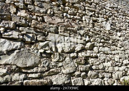 old stone wall made by hand Stock Photo