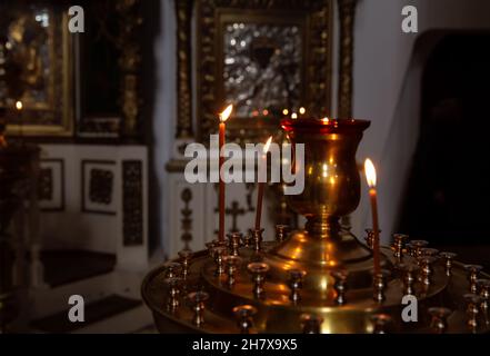 Burning candles in front of an icon in the Orthodox Church Stock Photo