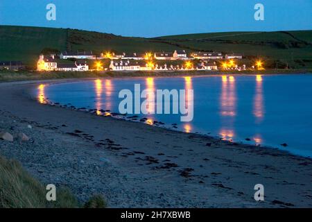 Port Logan lit at night, Wigtownshire, Dumfries & Galloway, Scotland Stock Photo