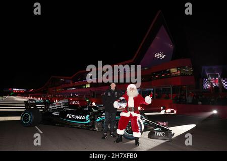 Anthony Davidson (GBR) Drives the Formula One Mercedes-AMG F1 W10 EQ Power+ around the Silverstone Lap of Lights whilst Father Christmas watches on Stock Photo