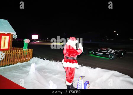 Anthony Davidson (GBR) Drives the Formula One Mercedes-AMG F1 W10 EQ Power+ around the Silverstone Lap of Lights whilst Father Christmas watches on Stock Photo