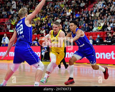 Finland's Daniel Dolenc and Shawn Huff tries to stop Sweden's  Ludde Hakanson during the Fiba World Cup European qualifier basketball match, 1st round Stock Photo