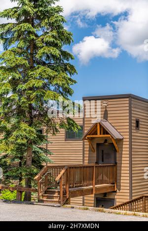 Sugar Mountain ski resort in Banner Elk town city in summer in North Carolina with apartment building entrance vintage old wooden house in Blue Ridge Stock Photo