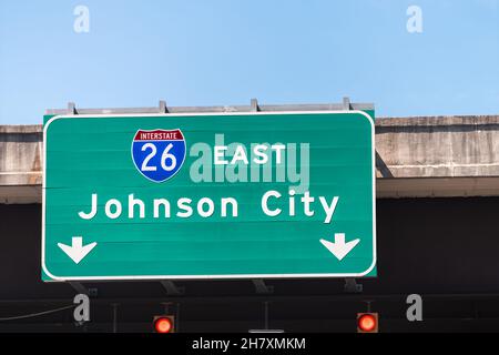 Johnson City, USA road street interstate highway green sign for i26 26 east to Johnson City in Tennessee with text isolated closeup and blue sky Stock Photo