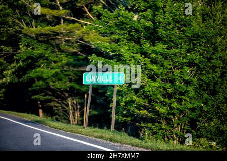 Sign on highway road near Grandfather Mountain State Park in Banner Elk, North Carolina for miles to famous Linville Falls on Blue Ridge Parkway drivi Stock Photo