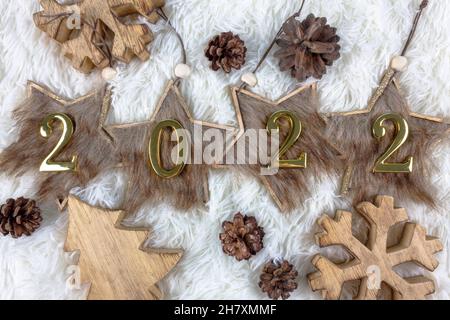 Christmas and New year concept. Christmas decorations on fluffy white background. Holiday festive celebration greeting card. Flat lay. Stock Photo