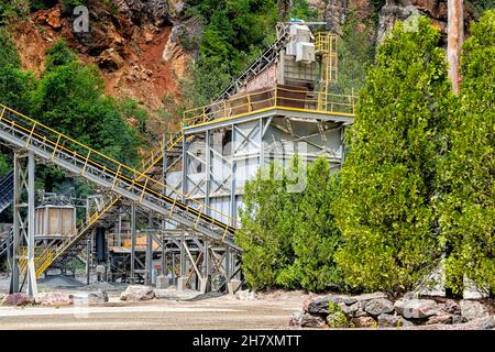 Mountain City, Tennessee, USA city with industrial factory coal conveyor belt power plant exterior architecture with elevator lift in Appalachian moun Stock Photo