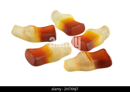Cola flavored gummy jellies in the shape of cola bottles,isolated on white background. - Image Stock Photo