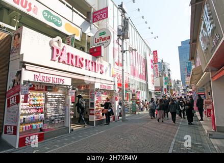 Takeshita Street or Takeshita-dori, a bustling street in the Harajuku part of Tokyo in Japan selling vibrant and extreme fashion, food, and more. Stock Photo