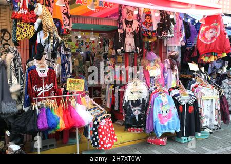 Takeshita Street or Takeshita-dori, a bustling street in the Harajuku part of Tokyo in Japan selling vibrant and extreme fashion, food, and more. Stock Photo