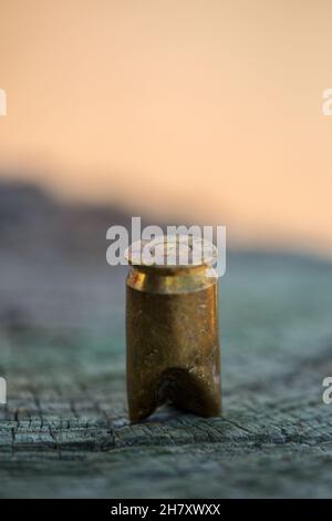 bullet casing abandoned on the ground Stock Photo