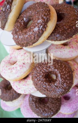 Pile of delicious almond sprinkled donuts. Overhead view Stock Photo