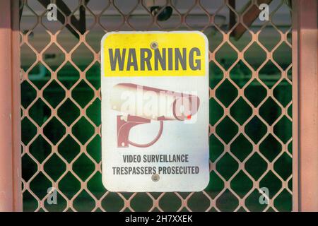 Warning sign on a mesh diagonal railings at Coronado, San Diego, California Stock Photo
