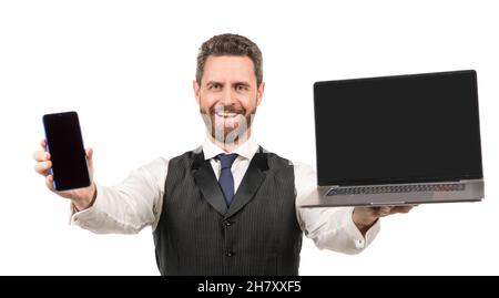 happy man presenting laptop and smartphone isolated on white background, modern life Stock Photo