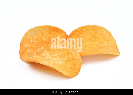 Three slices of paprika chips isolated on white background. Junk food Stock Photo