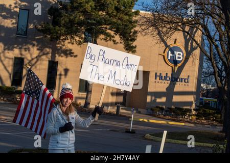 St. Paul, Minnesota. November 20, 2021. Medical freedom rally. Woman holding sign outside Hubbard broadcasting to tell them to cover their protests an Stock Photo