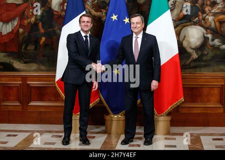Rome, Italy. 25th Nov, 2021. Italian Prime Minister Mario Draghi (R) shakes hand with French President Emmanuel Macron in Rome, Italy, on Nov. 25, 2021. French President Emmanuel Macron and Italian Prime Minister Mario Draghi met Thursday to work toward finalizing the 'Quirinale Treaty.' Credit: Str/Xinhua/Alamy Live News Stock Photo