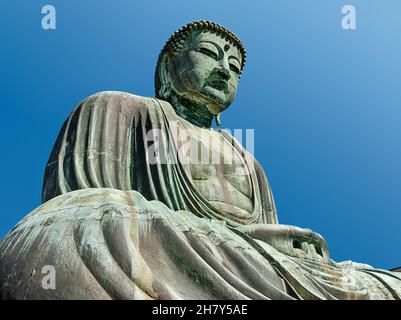 A view of the giant bronze Buddha at the Daihatsu Shrine in Kamakura, Japan. Stock Photo