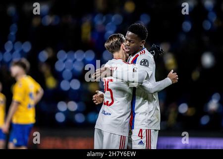 Broendby, Denmark. 25th Nov, 2021. Castello Lukeba (4) and Maxence Caqueret (25) of Lyon seen after the UEFA Europa League match between Broendby IF and Lyon at Broendby Stadion in Broendby. (Photo Credit: Gonzales Photo/Alamy Live News Stock Photo
