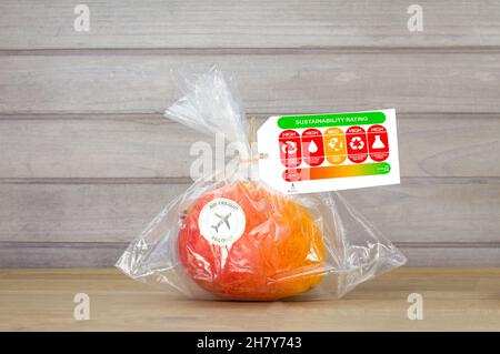 consumer food sustainability label on air freight mango with product rating for sustainable food ethical concept Stock Photo