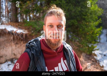 Outdoor portrait of blond hipster man in nature. Stock Photo