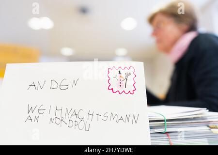 Himmelstadt, Germany. 24th Nov, 2021. A letter to Santa Claus lies on a table at the Christmas post office in Himmelstadt. When children send their wishes to the Christ Child in the form of letters, they end up at the Christmas post office in Himmelstadt. (To dpa 'Children write wishes to the Christ Child again - off to the Christmas post office' from 26.11.2021) Credit: Nicolas Armer/dpa/Alamy Live News Stock Photo