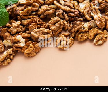 Walnuts  without shell on a brown background Stock Photo